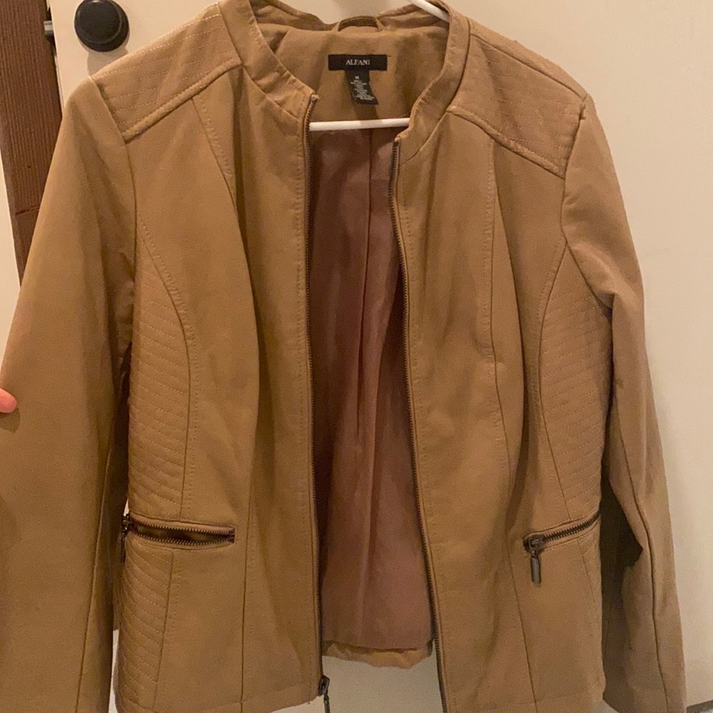 Never been worn. Slight thread tear on behind right shoulder from moving around